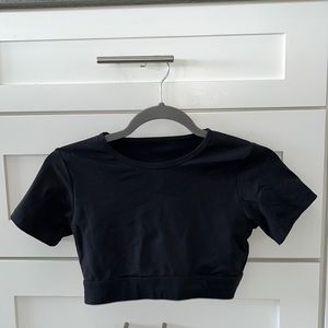 Black NVGTN backless crop top. Size S